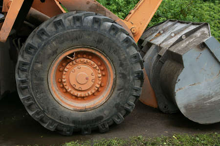 The large wheel is a part of a excavatorの写真素材