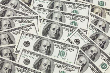 Banknotes in 100 US dollars have put the friend on the friend and have made a background of money