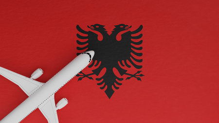 Top Down View of a Plane in the Corner on Top of the Country Flag of Albaniaの写真素材