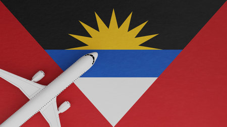 Top Down View of a Plane in the Corner on Top of the Country Flag of Antigua and Barbudaの写真素材