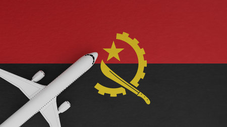 Top Down View of a Plane in the Corner on Top of the Country Flag of Angolaの写真素材