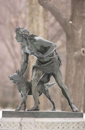 Photo of sculpture of man with dogの写真素材