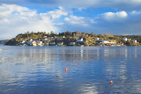 Photo of isoleted houses by the coast in the south of Norway 