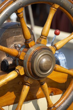 A photo of steering wheel on an old sailing boatの写真素材