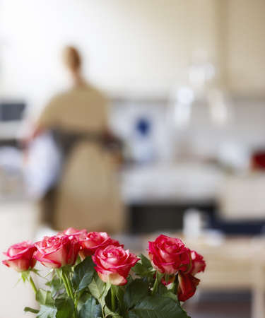 A photo of roses in the kitchen with active housewifeの写真素材