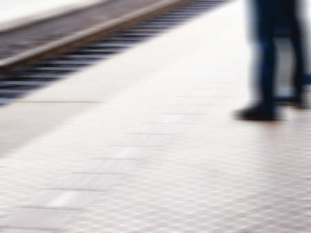 A motion and lens burred image of people moving の写真素材