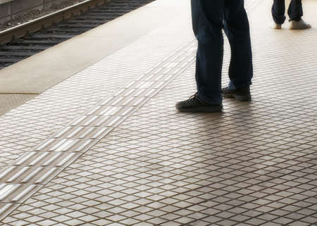 A motion and lens burred image of people moving の写真素材