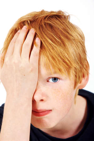 A worried and thoughtful schoolboyの写真素材