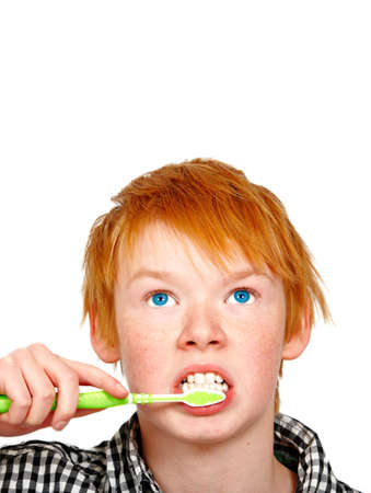 a photograph of a teenage boy who brushes his teethの写真素材