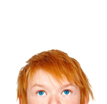 a photograph of a teenage boy looking upの写真素材