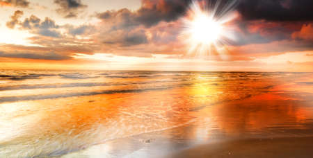 a photo of dramatic ocean sunsetの写真素材