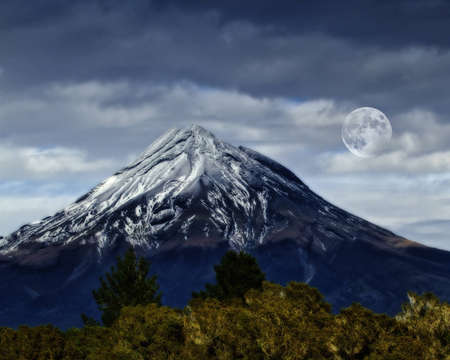 A  photo of a Volcano and the moonの写真素材