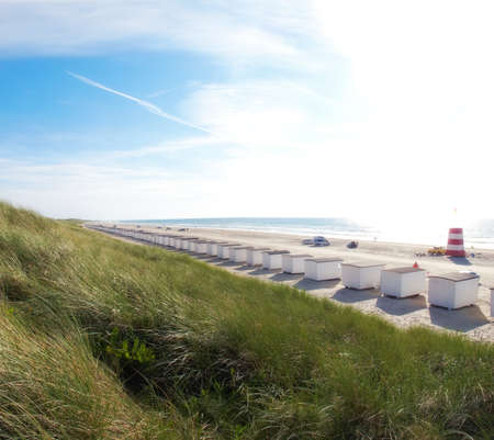 A photo of beach houses - the beach of Jutland, Denmark. Longest beach in the worldの写真素材