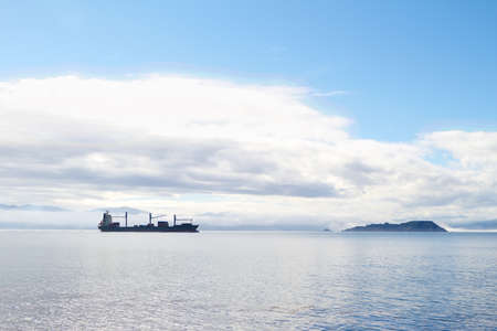 A photo of a cargo ship early morningの写真素材