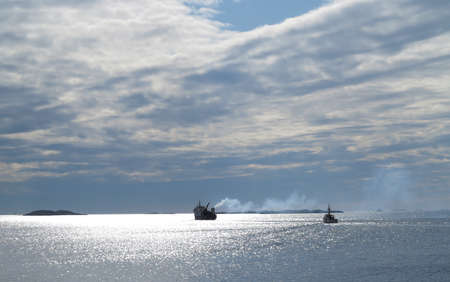 A photo of small Norwegian harbor North of the Polar Circle, Bodoe. Wintertime light.の写真素材