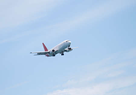 A telephoto of an airplane flyingの写真素材