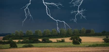 Dark clouds in harvestの写真素材