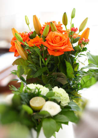 A photo of a Bouquet of beautiful flowers in a vase indoorの写真素材