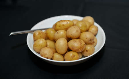 A photo of a bowl of potatoesの写真素材