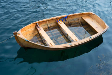 A photo of a rowBoat on the serene water