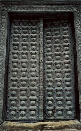 Detail of an ancient wooden door in Kathmandu, Nepalの写真素材