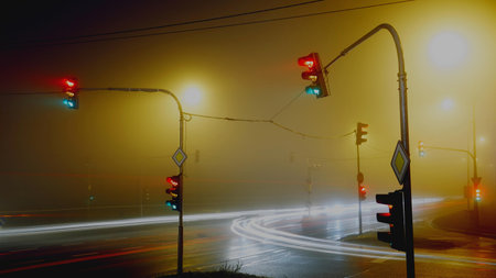Traffic lights on the road in the foggy morning. Long exposureの写真素材