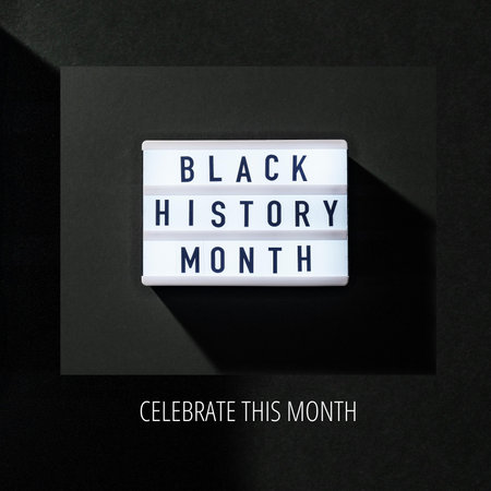 Black history month text on lightbox on black background, top viewの写真素材