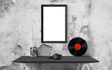 Black and white photo frame on the table in front of the wallの写真素材