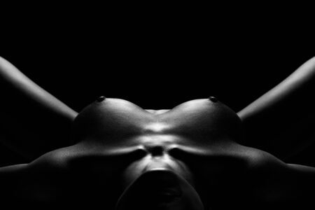 A naked woman lying flat on back with legs apart.の写真素材