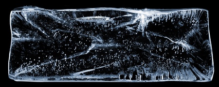 Large rectangle of clear ice with bubbles, on black.