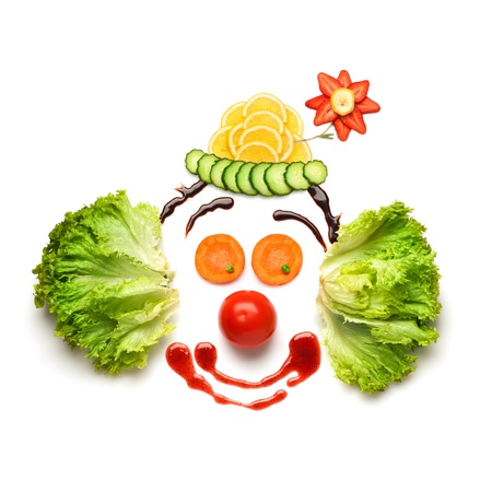 Happy meal for opponents of fast-food  A nice and funny edible clown, made of strawberries, lemons, salad and so on の写真素材