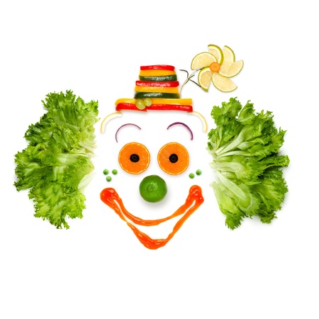 Cheer your life like your food does - A portrait of joyful clown made of vegetables and sauce.