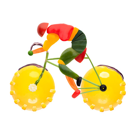 Fruits and vegetables in the shape of a male cyclist on a road bike の写真素材