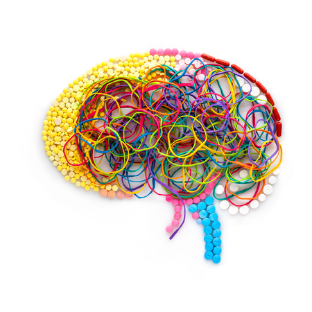 Creative concept of a human brain made of drugs, pills and colorful rubber bands as a memory illustration.の写真素材