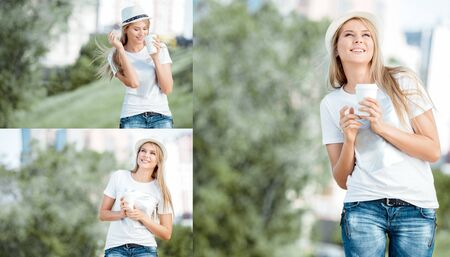Beautiful young woman walking with a disposable coffee cup, drinking coffee, and smiling against urban nature background.の写真素材