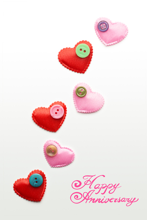 Creative valentines concept photo of hearts with buttons on white background.の写真素材