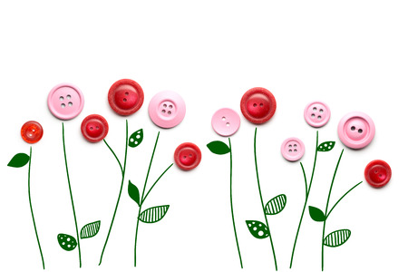 Creative valentines concept photo of a flowers made of buttons on white background.