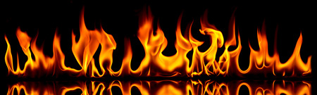 Fire flames on a black background.の写真素材