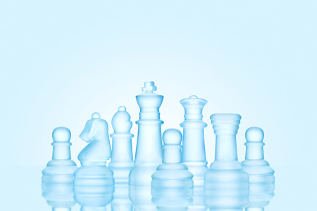 Strategy and leadership concept; frosted chess figures made of ice, standing together as a family ready for game.の写真素材