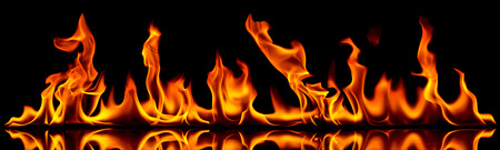 Fire flames on a black background.の写真素材