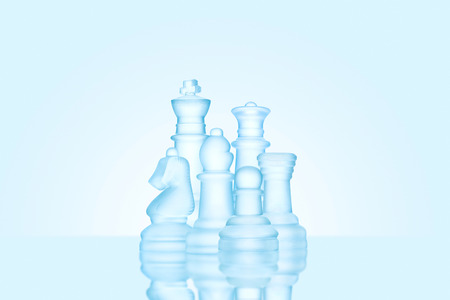 Strategy and leadership concept; frosted chess figures made of ice, standing together as a family ready for game.の写真素材