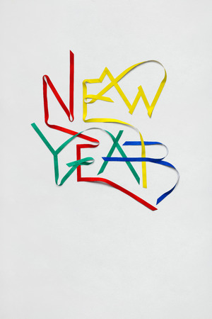 Creative photo of new year sign made of paper on white background.の写真素材