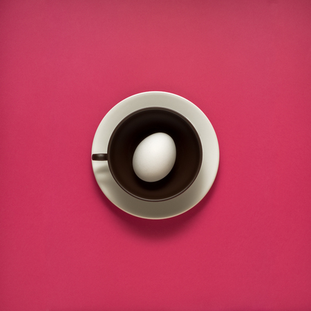 Creative concept photo of kitchenware, painted plate with food on it on pink background.の写真素材