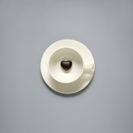 Creative concept photo of kitchenware, painted plate with food on it on grey background.の写真素材