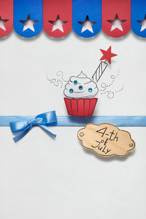 Creative 4th of July concept photo of cupcake made of paper on white background.の写真素材