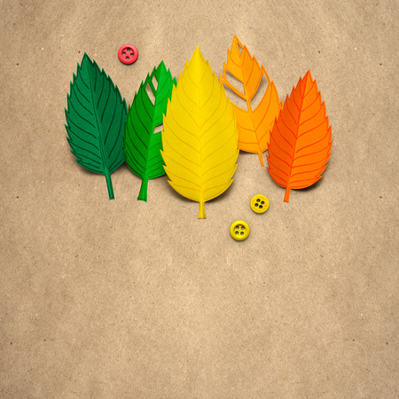 Creative thanksgiving day concept photo of leaves made of paper on brown background.の写真素材
