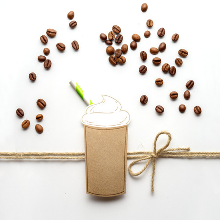 Creative concept photo of a cup of coffee made of paper on white background.の写真素材