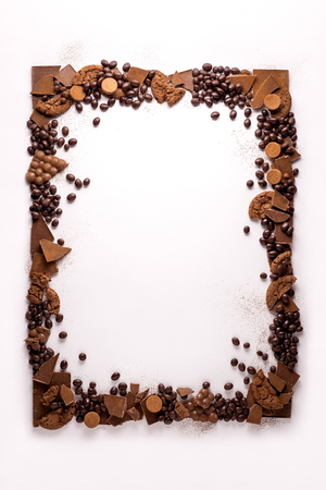 Creative concept photo of frame made of chocolate on white background.の写真素材