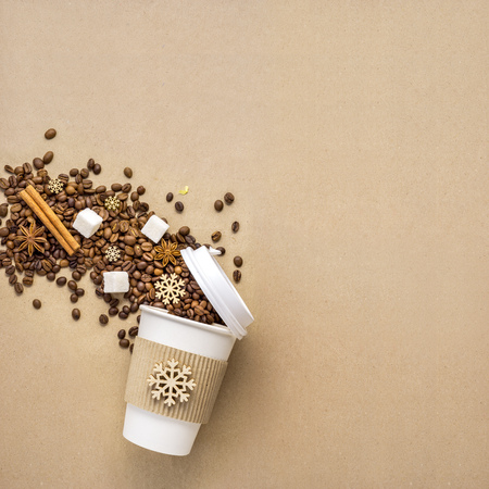 Creative concept photo of take away coffee cup on brown background.の写真素材