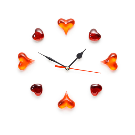 Creative valentines concept photo of clock with hearts on white background.の写真素材